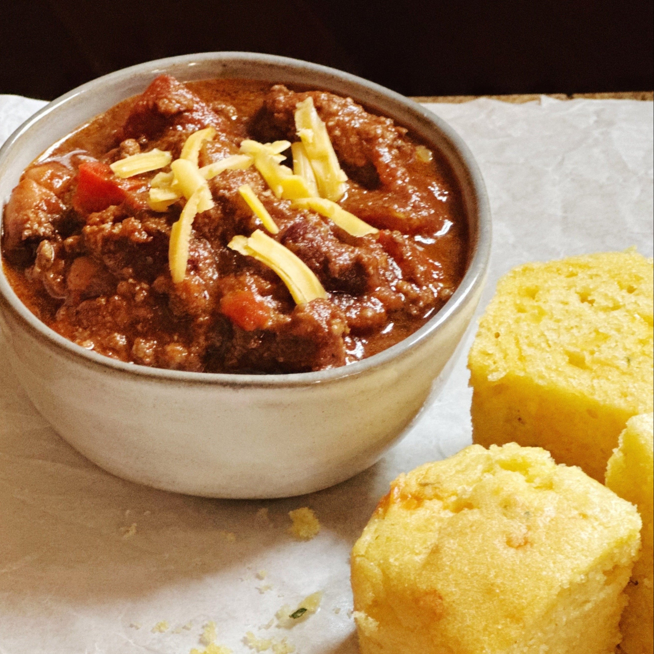 Frozen beef chili with smoky and sweet flavors, reheated and served with cornbread