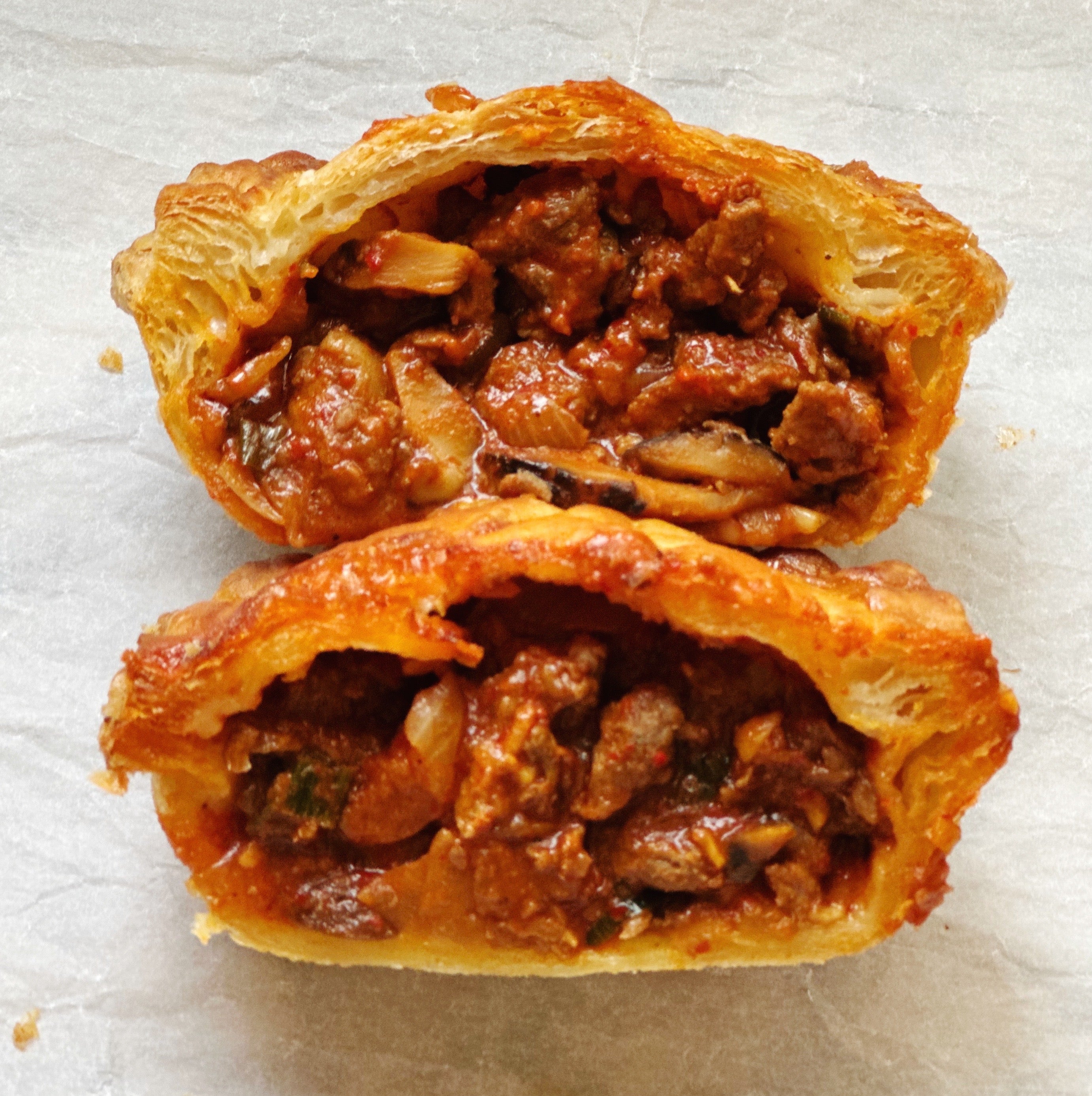 Spicy Korean-style beef steak pot pie featuring bold beef filling and a flaky puff pastry crust