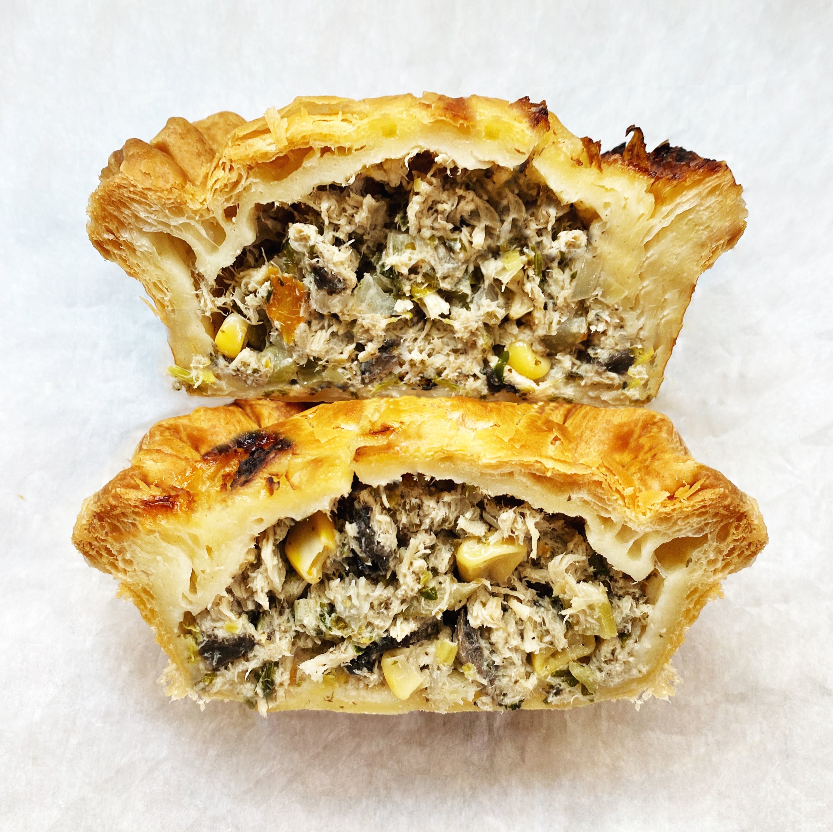 Chicken pot pie with mixed vegetables and a flaky puff pastry crust