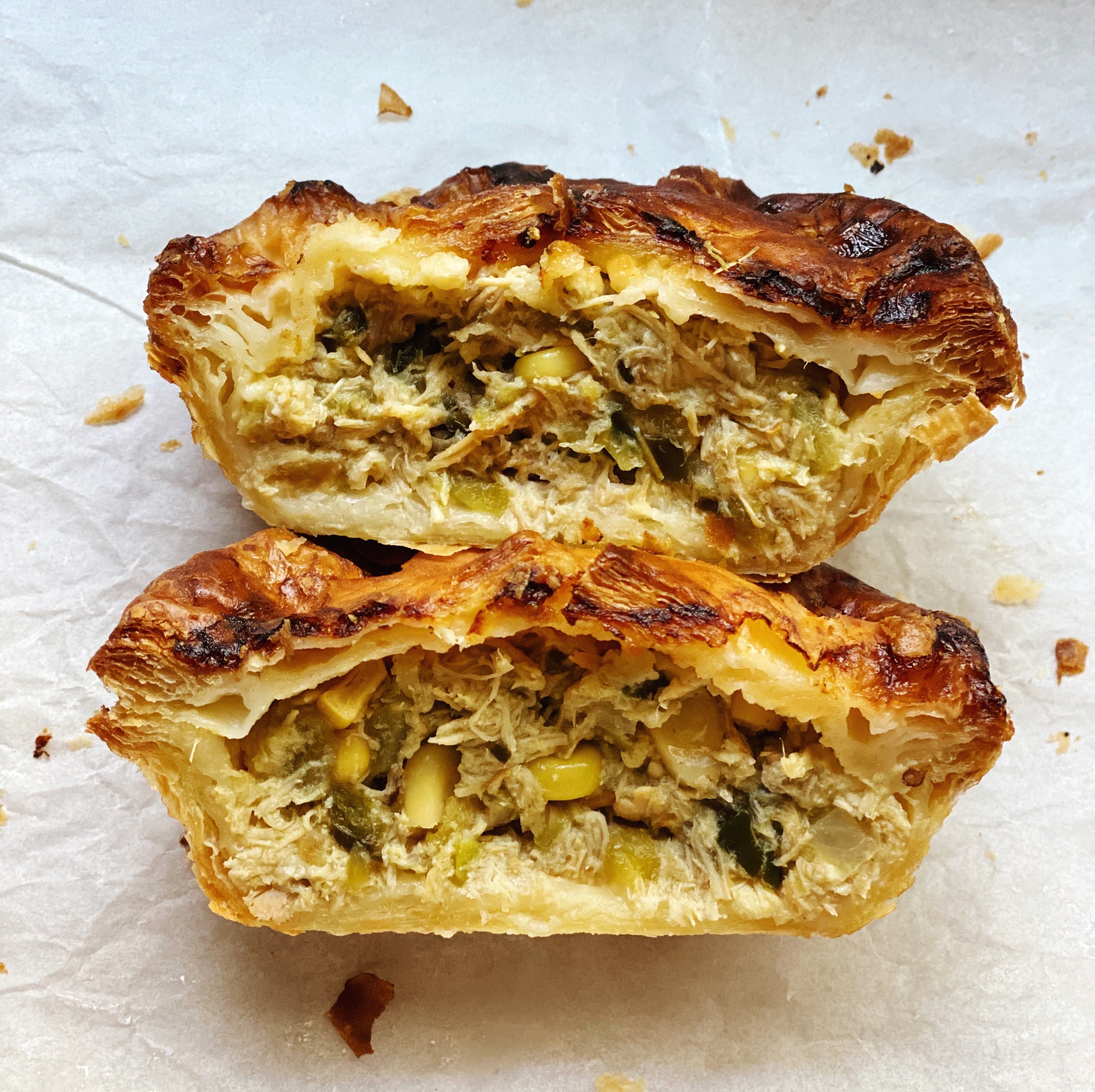 Bake-at-home green chile chicken pot pie with zesty filling and a flaky puff pastry crust